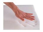 Hand pressing into a white memory foam mattress or pillow, showing its soft and conforming texture.