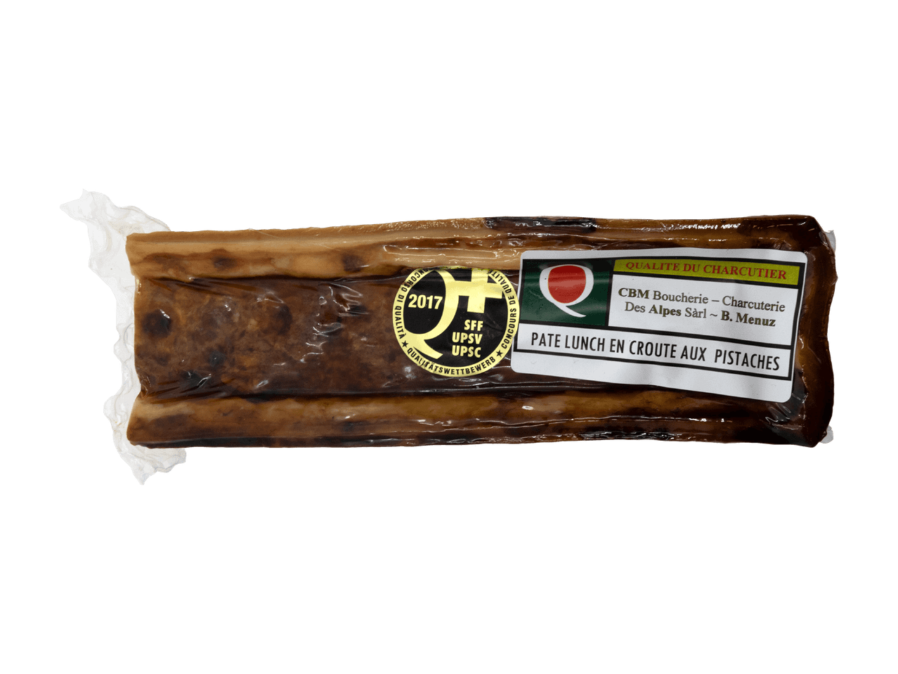 Pâté en croûte aux pistaches et persil sur une planche d'ardoise.