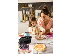 SILVERCREST waffle maker with mother and daughter decorating waffles with berries.