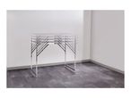 Height-adjustable folding table with multiple height settings in a room.