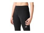 Woman in black athletic leggings with a side pocket and zipper detail.