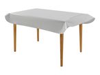 Rectangular table with wooden legs and a white plastic tablecloth