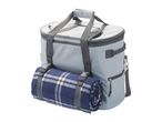 A gray insulated picnic backpack with a navy plaid blanket attached.