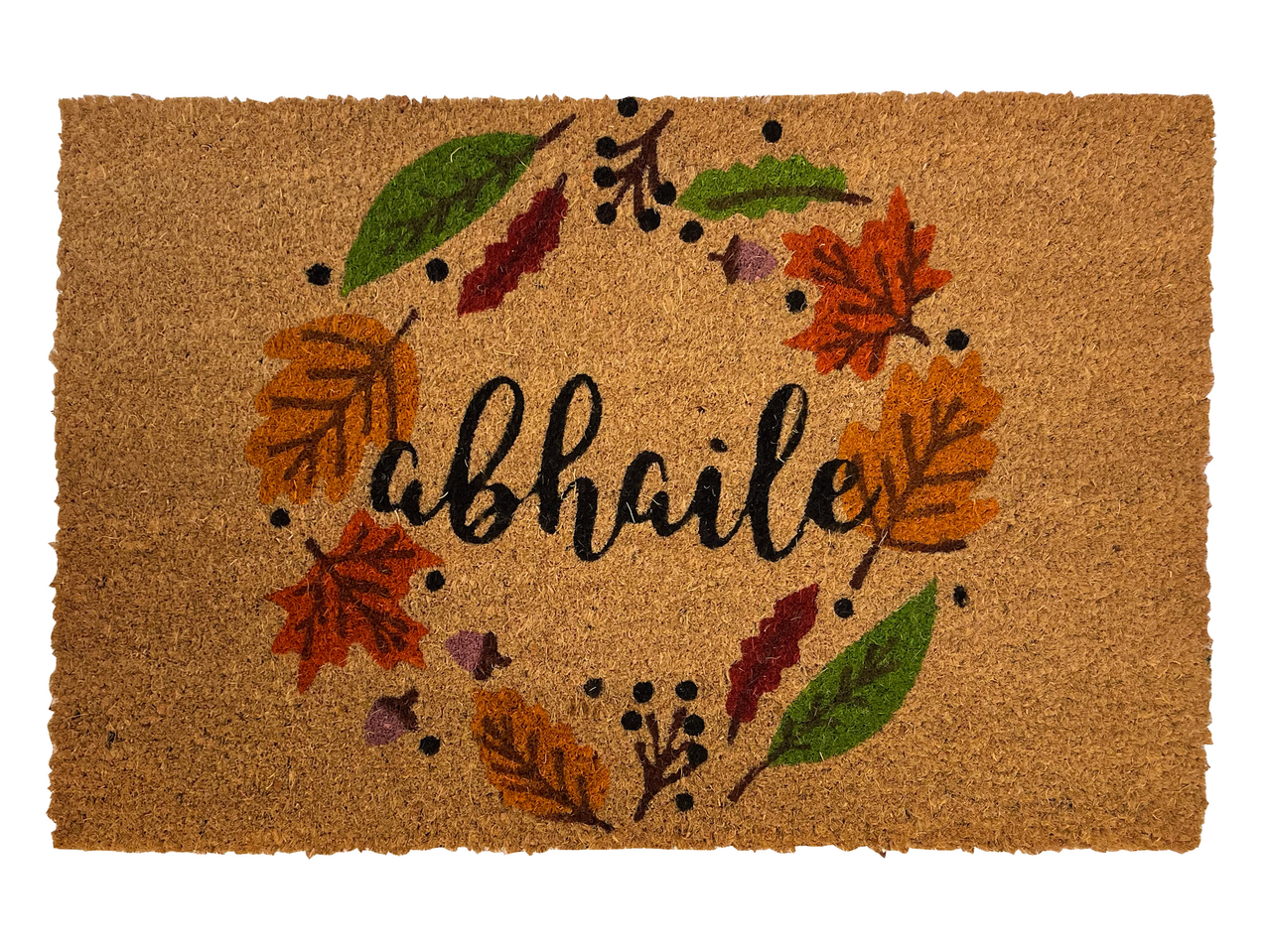 Doormat with a fall-themed wreath design and the word 'abhaile' in the center.