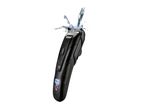 Black hair clipper with a digital display showing 100% battery, being splashed with water.