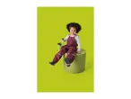 Smiling child in burgundy waterproof overalls and boots, holding a green bucket.