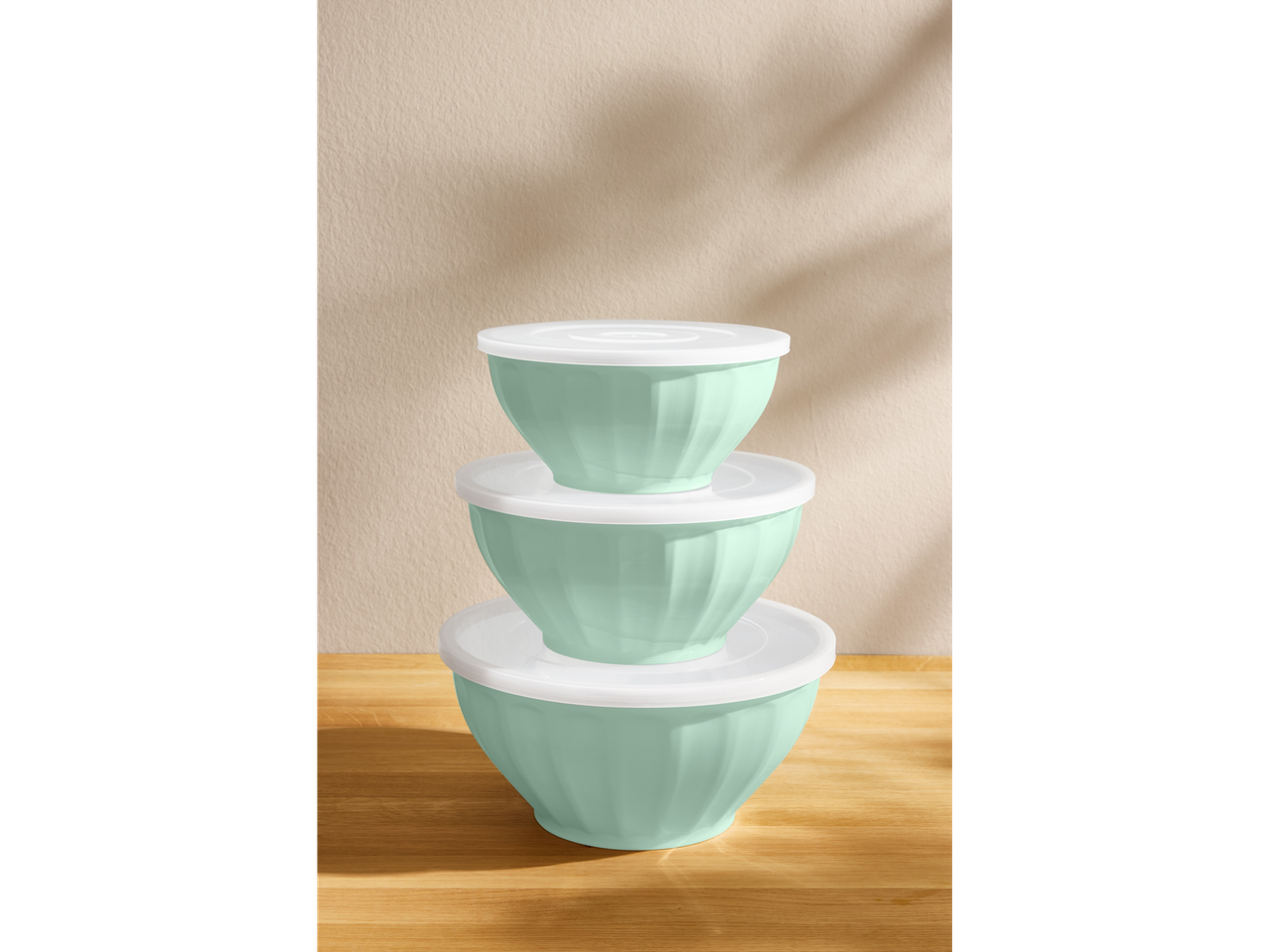 Silvercrest Set of Bowls with Lids: Stacked mint green bowls on a wooden surface