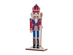 Wooden nutcracker figurine in red, blue, and gold uniform with a crown and staff