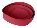 Three nested red silicone bowls on a white background.