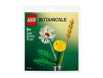 A clear plastic bag containing a set of botanical-themed building blocks, featuring field flowers.