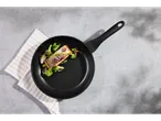 Silvercrest® pan with salmon, broccoli, and red onion on a gray surface.