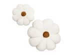 Two white flower-shaped cushions with brown centers
