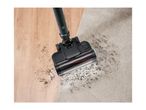 Vacuum cleaner head cleaning dirt on wooden floor and carpet