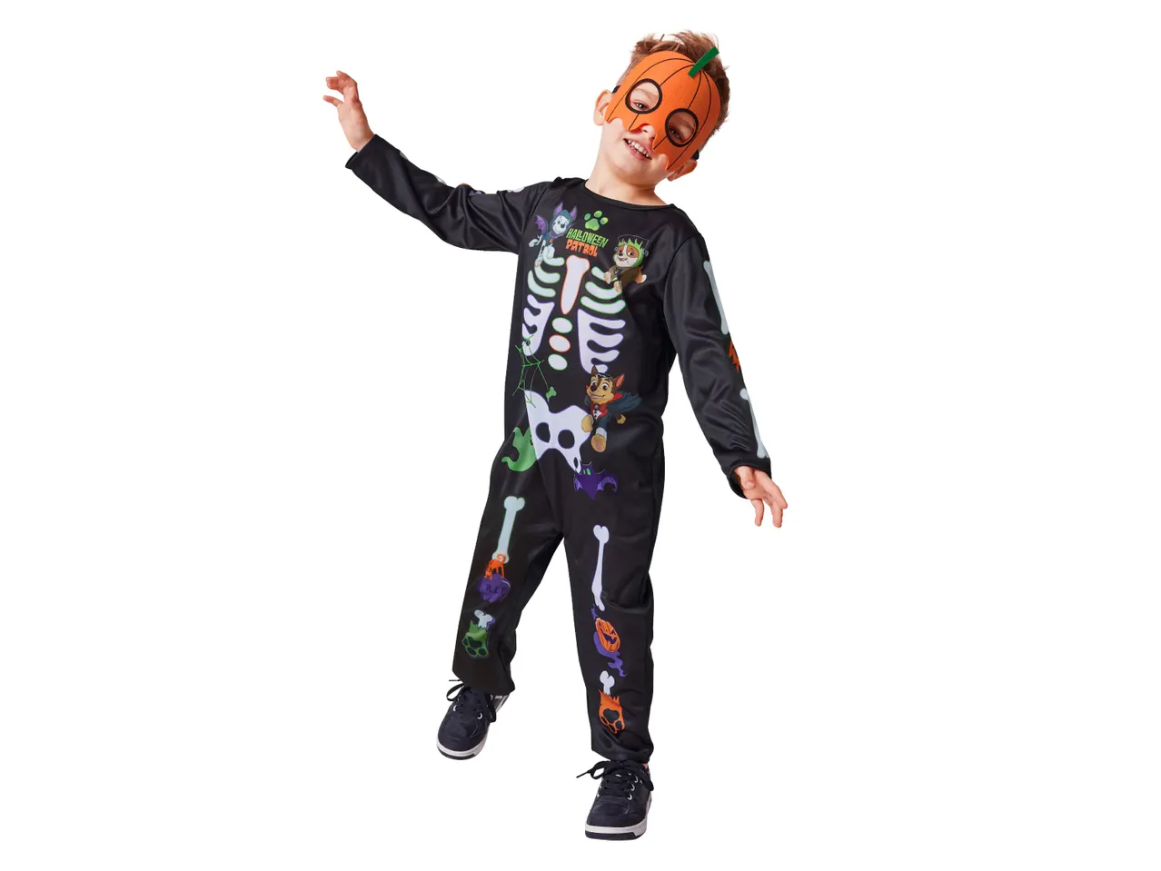 A boy in a Paw Patrol skeleton Halloween costume with a pumpkin mask.