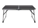 Black folding camping table with silver aluminum frame and legs, isolated on a white background.