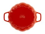 Bottom view of a red, pumpkin-shaped cast iron casserole dish with handles