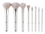 Seven silver-handled makeup brushes, including three large powder brushes and four smaller detail brushes.