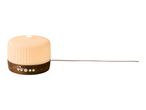 Aroma diffuser with a wooden base and warm light