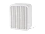 A white rectangular air purifier with a slatted front panel and a power cord.