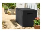 Black rattan-style garden storage box on a patio with potted plants.