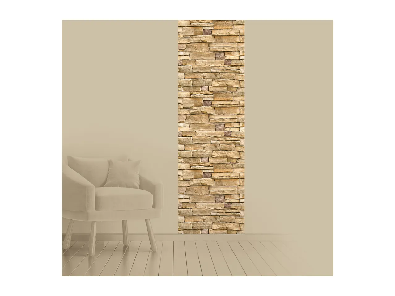 A beige armchair with a cushion next to a wall with a vertical stone cladding panel.