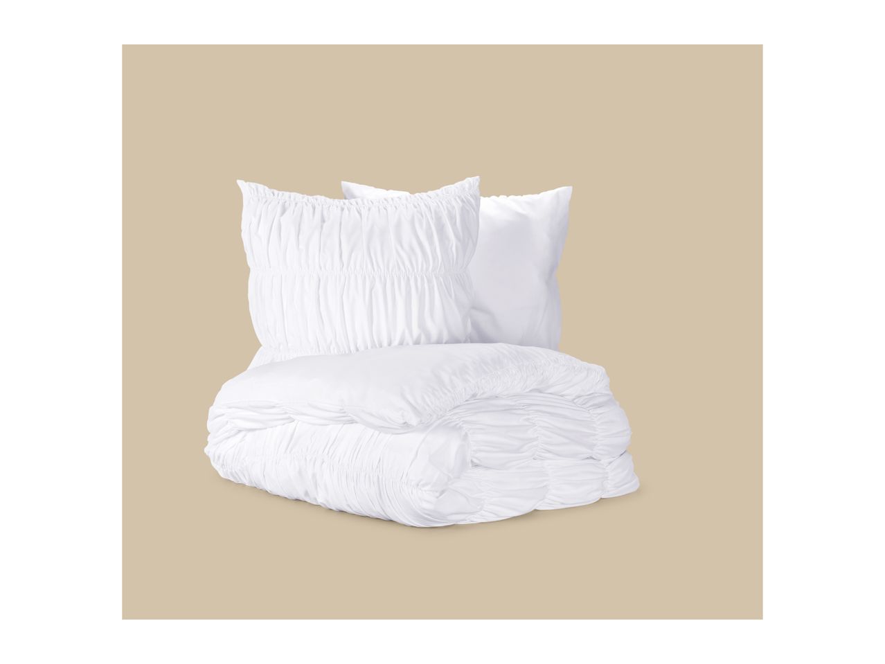 White ruched bedding set with a folded duvet and two pillows