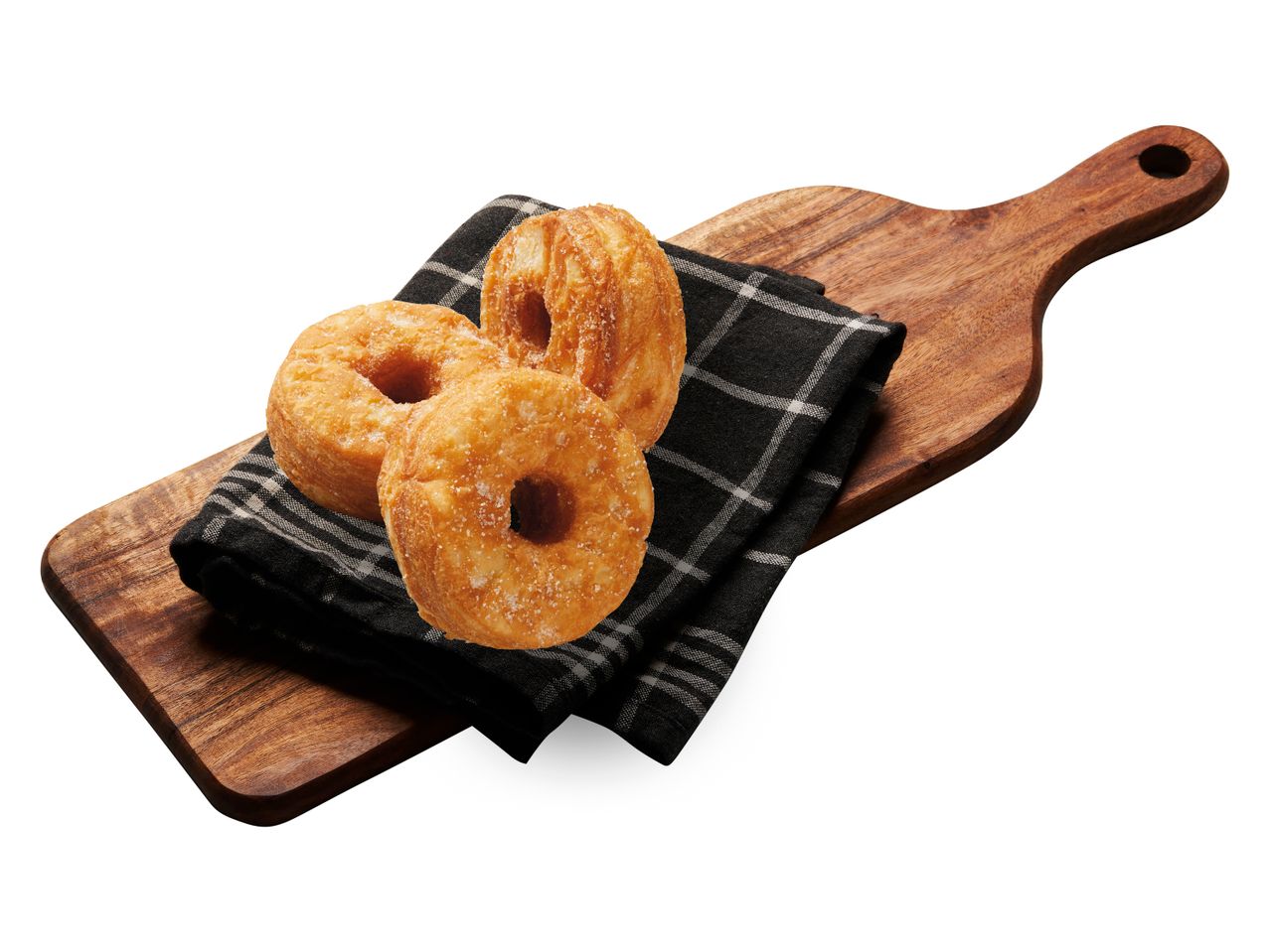 Sockerdonuts på en träbräda.