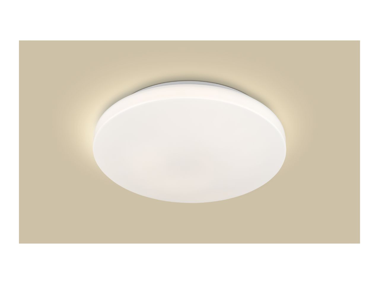 Round white LED ceiling light with warm glow on a beige background