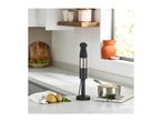 Hand blender on a kitchen counter with potatoes and mashed potatoes in a pot.