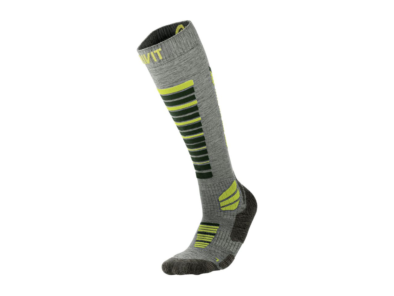 A single grey ski sock with neon yellow and dark green stripes and accents.