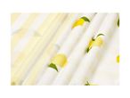 Yellow and white striped fabric with lemon print, folded.