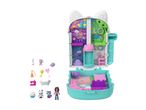 A Gabby's Dollhouse playset shaped like a cat's head, with various accessories and figures.