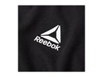 Close-up of a black fabric with a white triangular logo and text.