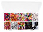 A clear plastic organizer box filled with various colorful beads and elastic cords.