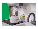 Toy kitchen with a pot on the stove, a clock, and a fruit bowl.