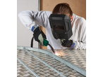 Person welding metal with a PARKSIDE® Inverter Flux Cored Wire Welder, sparks flying.