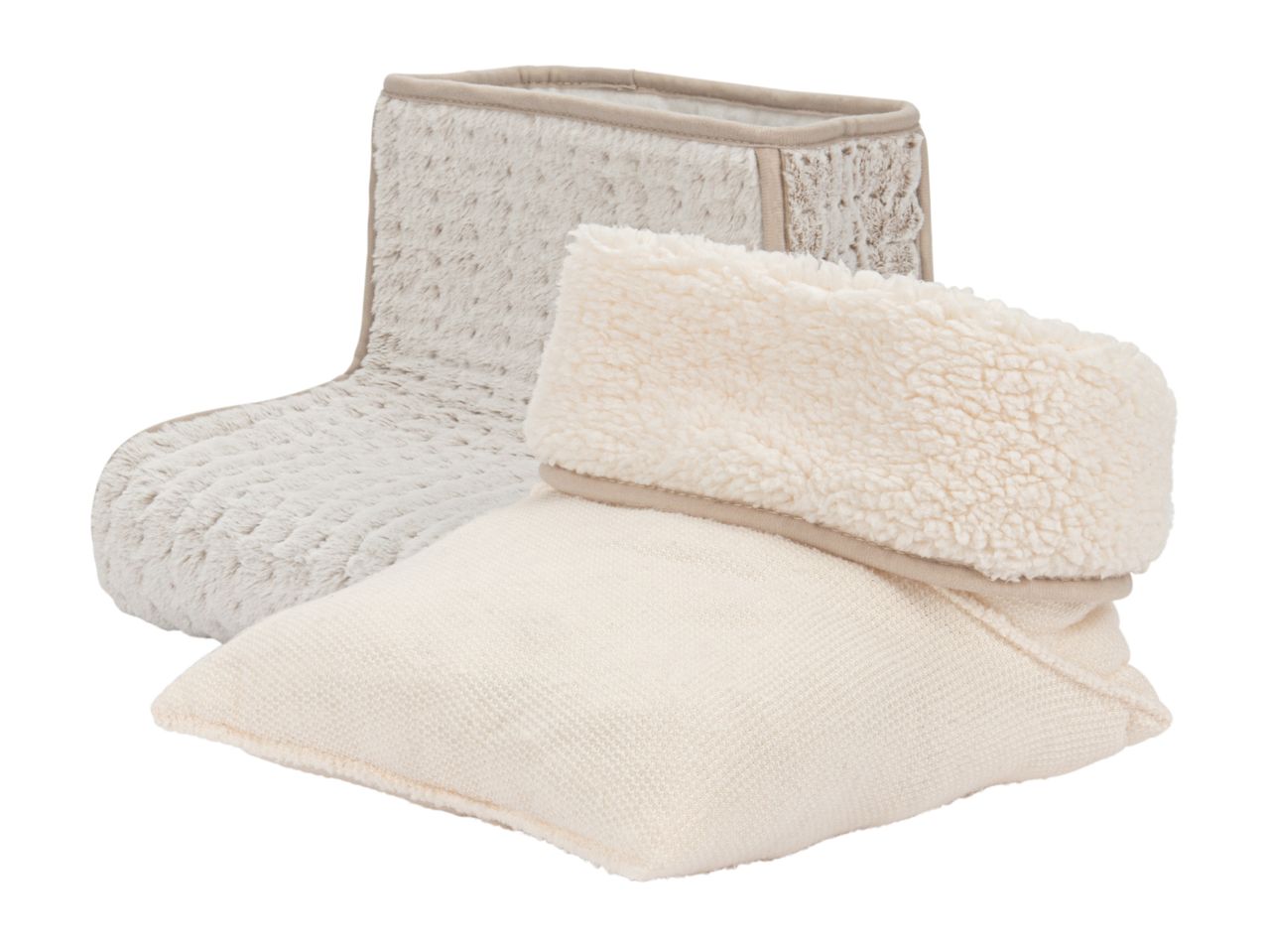 Two cozy slippers, one beige faux fur bootie and one cream knitted slipper with a sherpa cuff.