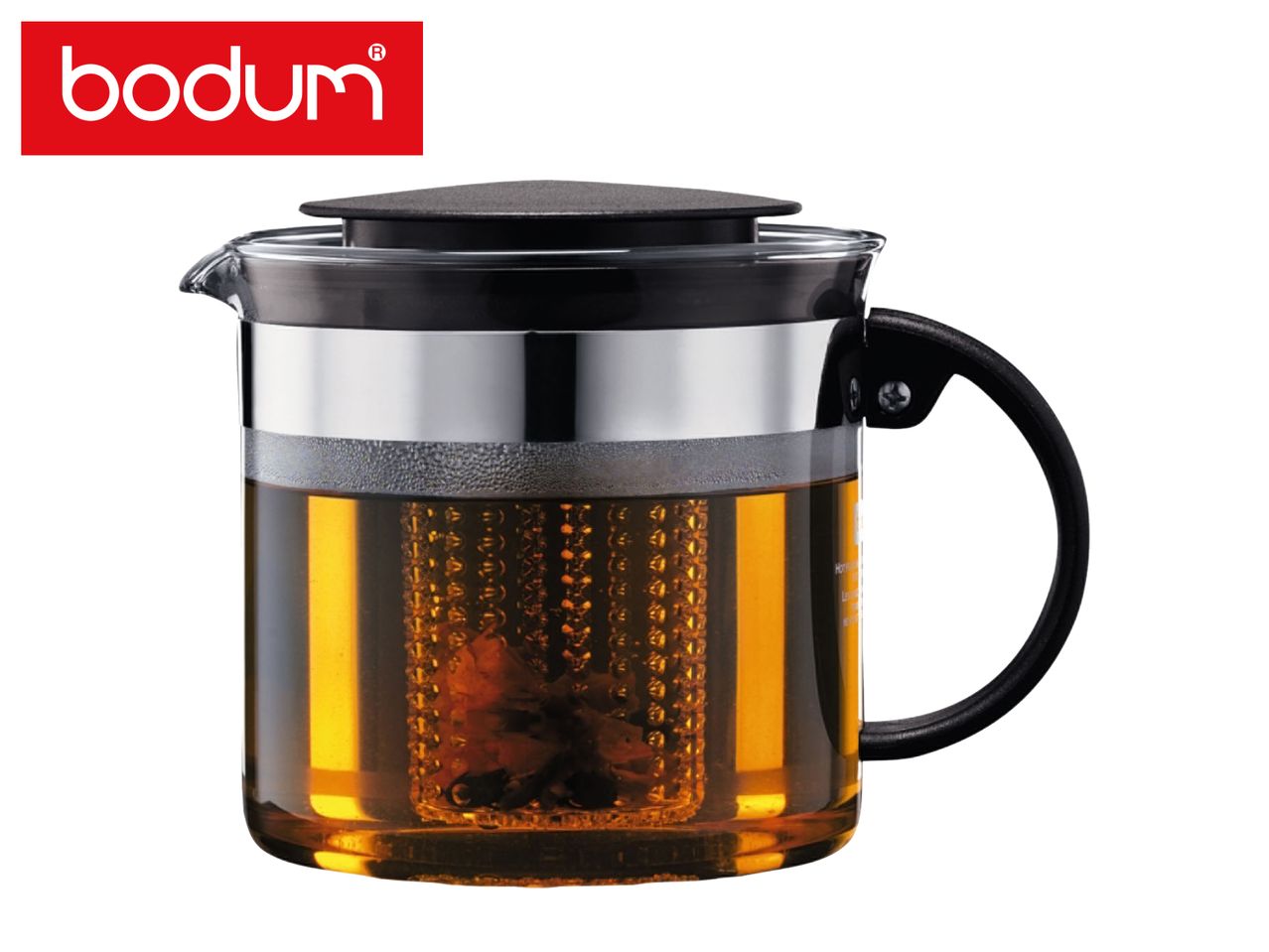 Glass teapot with a black lid and handle, filled with amber tea and a tea infuser.