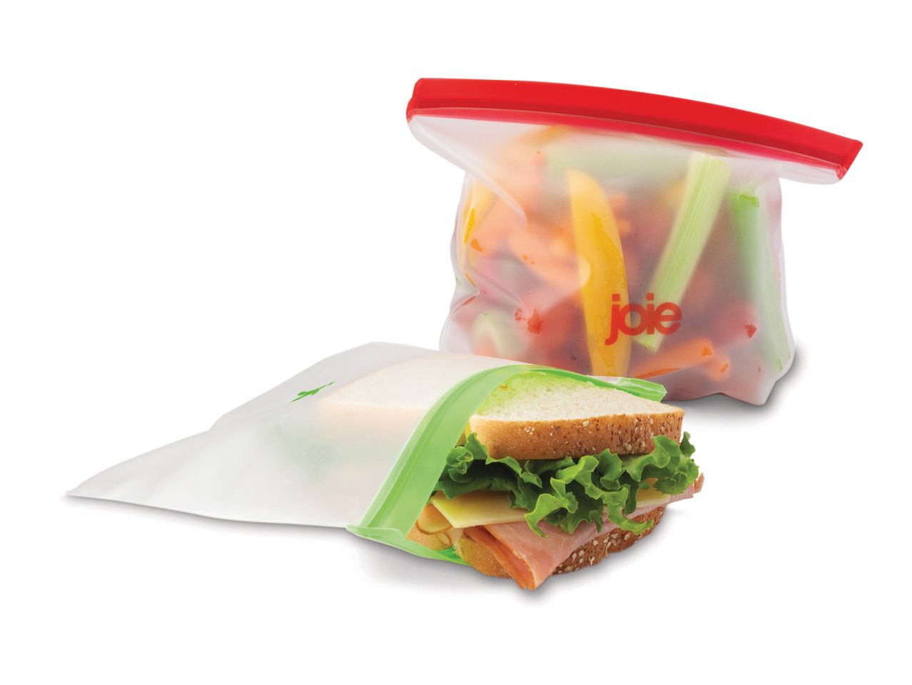 Reusable food storage bags, one with a sandwich and another with vegetables.