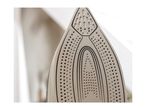 Close-up of the soleplate of a steam iron with many holes and black lines.