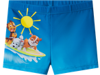 Calções de banho com estampado da Patrulha Pata a surfar sob o sol.