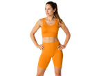 Orange ribbed sports bra and biker shorts.