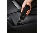 SILVERCREST® Mini Cordless Handheld Vacuum Cleaner being placed in a car door pocket.