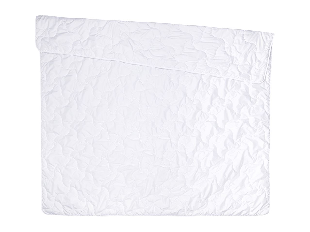 White quilted mattress protector with a wavy pattern, folded at the top left corner.