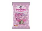 Sweet & Salted Popcorn in a pink bag with beach huts and a seaside scene.
