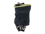 Foldable camping stool in a black carrying bag with a mesh pocket and olive green trim.