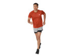 Man running in a rust-colored short-sleeved athletic top and grey and black shorts.
