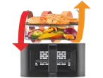 An air fryer with salmon and vegetables, with arrows indicating airflow.