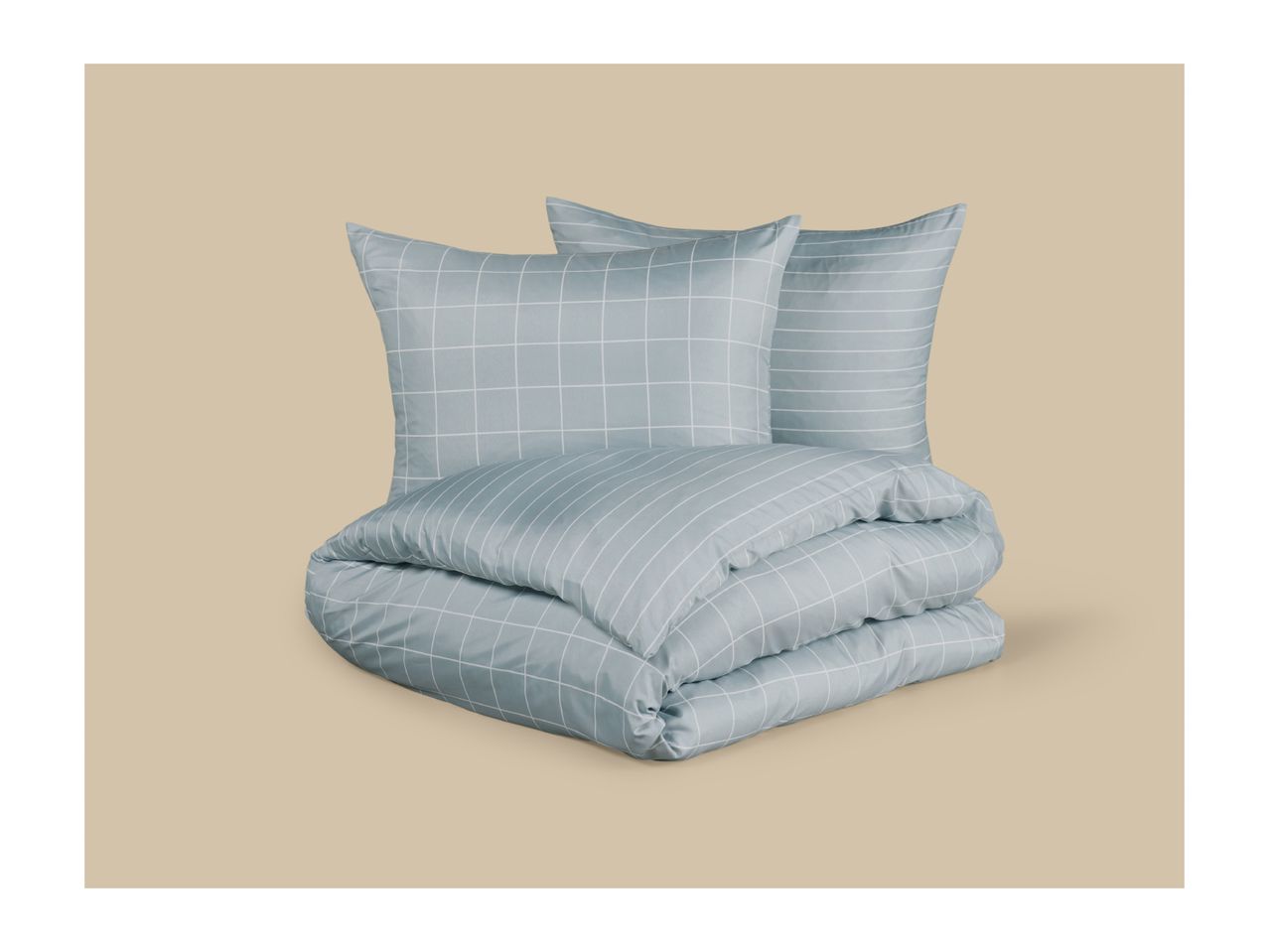 Light blue bedding set with a grid pattern, including two pillows and a folded duvet.