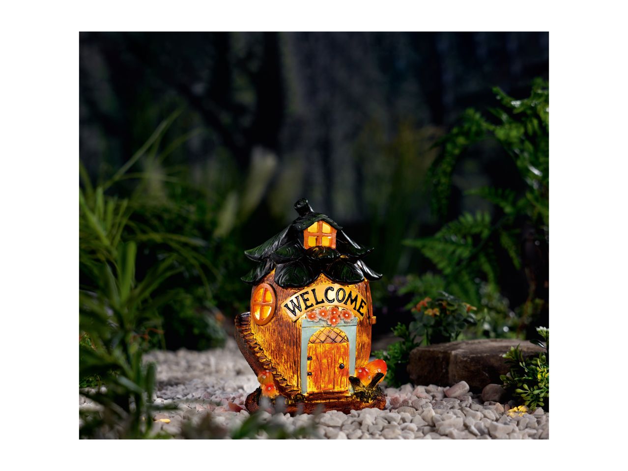 A whimsical fairy house with a 'WELCOME' sign, glowing windows, and a tiny staircase.